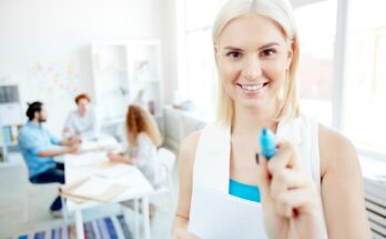 Optimistic sales manager preparing for monthly meeting